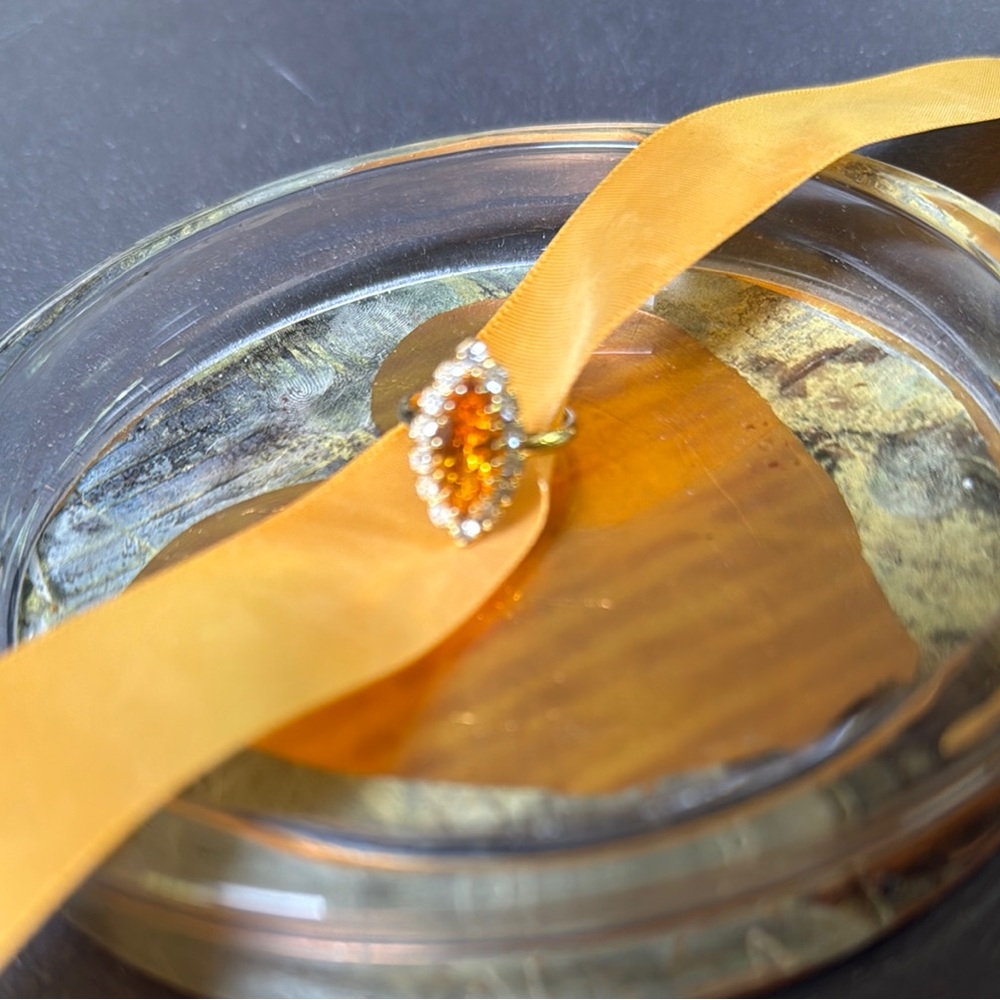 Elegant Gold and Topaz Color Gemstone Ring